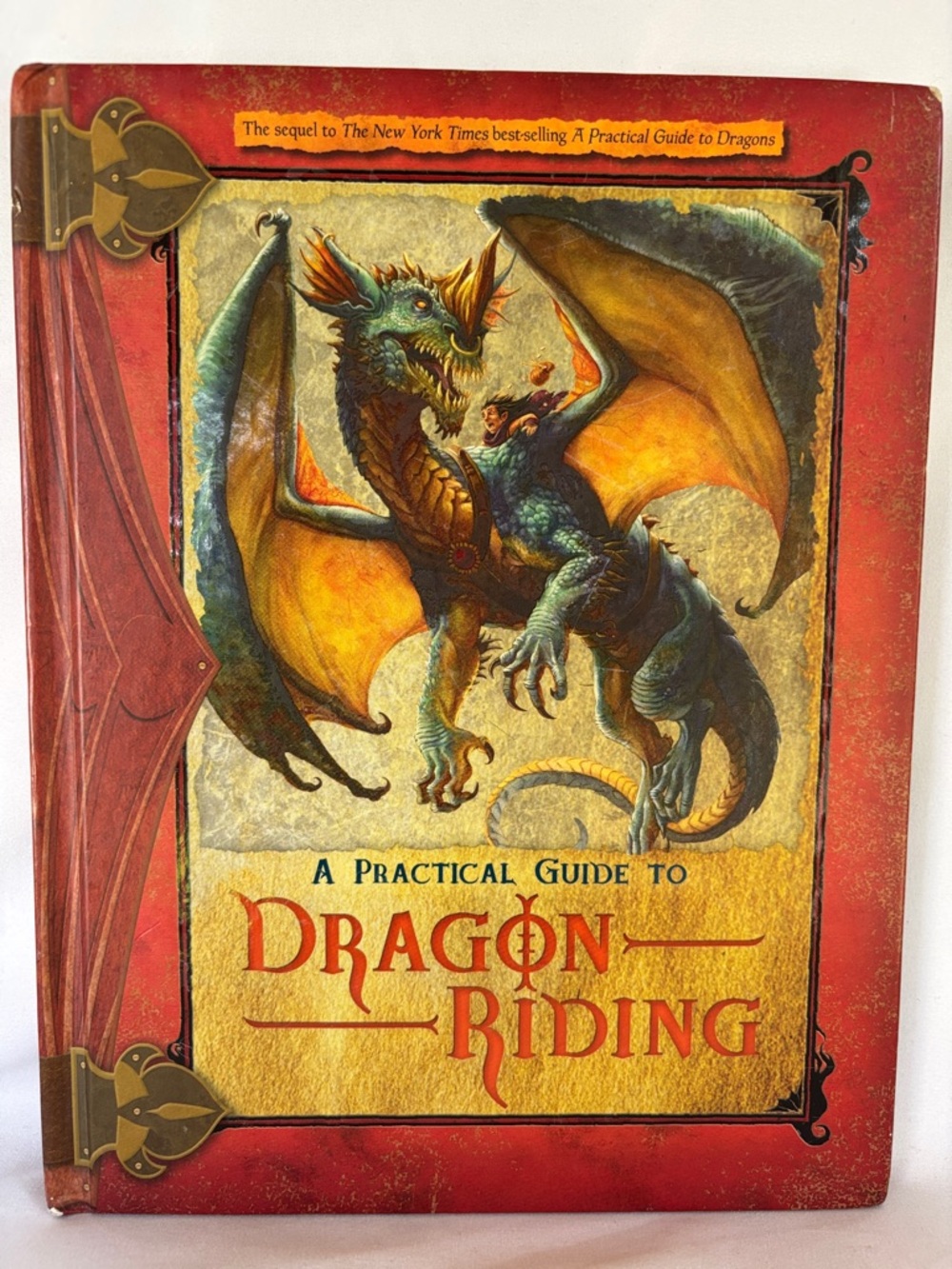 THE NEW YORK TIMES BEST -SELLING: A PRACTICAL GUIDE TO DRAGON 🐉 RIDING HARDCOVER